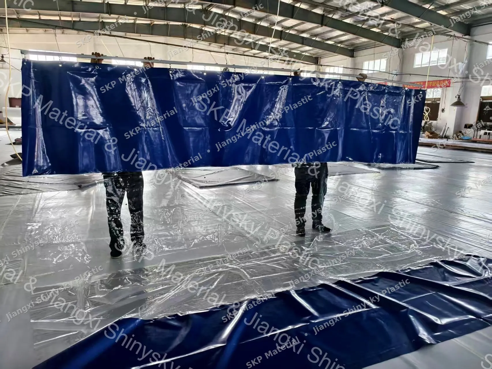 Finished PVC curtain panel hanging from its track bar at the SKP factory