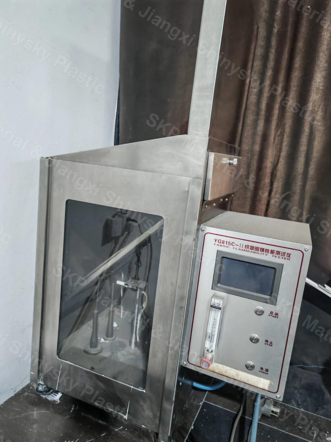 YG815C-II fabric flammability tester at the Jiangxi plant, used for in-house flame testing