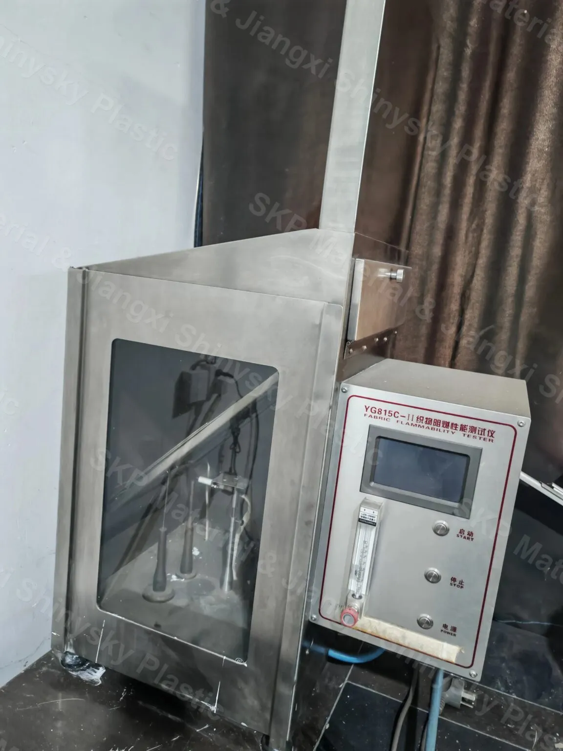 YG815C-II fabric flammability tester at the Jiangxi plant, used for in-house flame testing